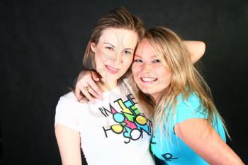 two 20-25 years women  friends having fun in studio