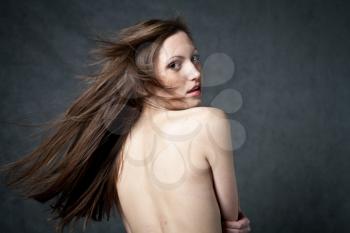 Fashion photo of beautiful seminude woman with magnificent hair