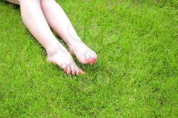 Womens Legs and grass outdoors