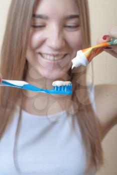 Dental Hygiene Concept - A close-up view of a blond woman with teeth brush