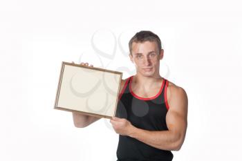 strong guy holding frame for text in the hands on white background