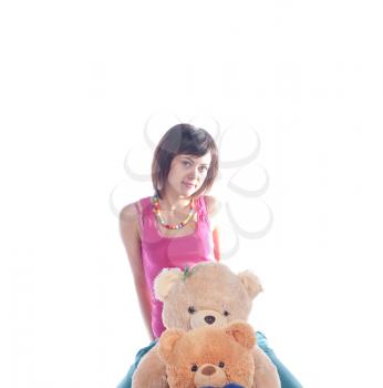 Fashion girl posing with teddy on white background