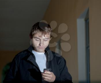 The young man with a mobile phone