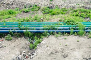 Green pipes on a ground  outdoors