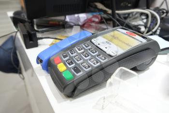 ASTRAKHAN, RUSSIA - JULY 01, 2014: POS terminal of CREDIT EUROPE BANK Ltd. in local store. Credit Europe Bank is owned by Fiba Group, one of the largest financial conglomerates in Turkey.