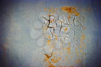 Corroded blue metal background. Rusted painted metal wall. Rusty metal background with streaks of rust. Rust stains. The metal surface rusted spots. Peeling paint.