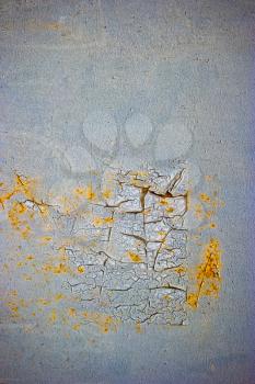 close-up of peeling painted wall of metal sheet.