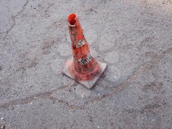 Traffic road-cone on the asphalt, damaged Traffic cone orbiting shot
