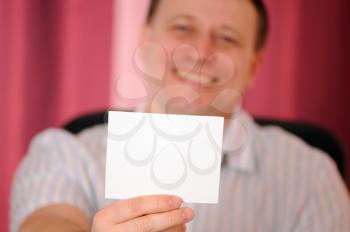 Royalty Free Photo of a Man Holding a Blank Card