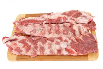 raw meat on a chopping board isolated on white background                               