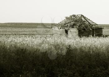 Royalty Free Photo of a Destroyed Building in a Field