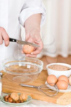 Royalty Free Photo of a Person Preparing Eggs