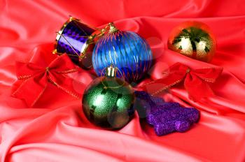 colorful Christmas decorations are on the red background