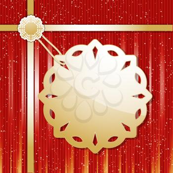 Gold Christmas snowflake label and ribbon on a red background 