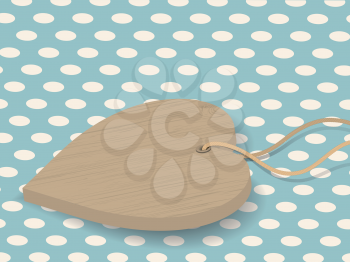 wooden heart on a blue polka dot background