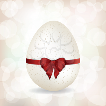 White Easter Egg with Red Ribbon on a glowing White Background