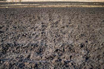 Royalty Free Photo of a Plowed Field In Spring Ready For Cultivation