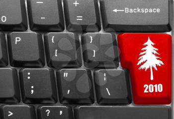 Royalty Free Photo of a Computer Keyboard With a Christmas Tree Button