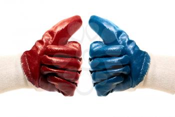 Royalty Free Photo of Two Different Colored Gloves Giving a Thumbs Up