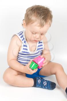 Royalty Free Photo of a Boy Playing With a Toy