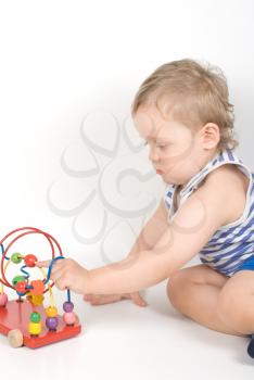 Royalty Free Photo of a Boy Playing With a Toy