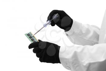 Royalty Free Photo of a Person Repairing a Microchip