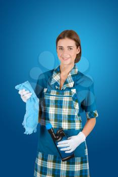 Royalty Free Photo of a Woman Cleaning in a Uniform