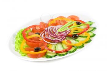 sliced vegetables at the dish isolated on a white