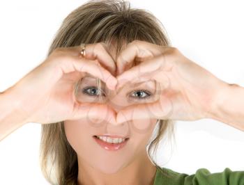 Royalty Free Photo of a Woman Making a Heart in Front of Her Face