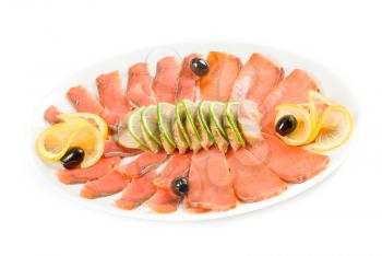 Sliced chum salmon and mackerel decorated with limes, lemons and olives isolated on white
