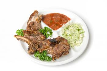 Royalty Free Photo of Grilled Meat With Vegetables and Sauce