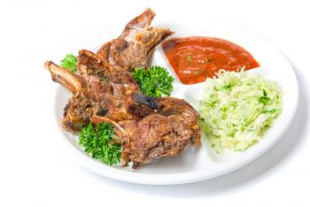 Dish of barbecued ribs isolated on a white background