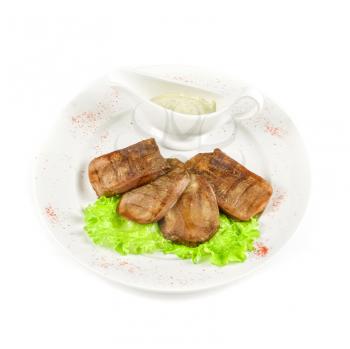 Beef tongue with sauce isolated on a white background