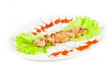 Grilled chicken meat and vegetables isolated on a white background