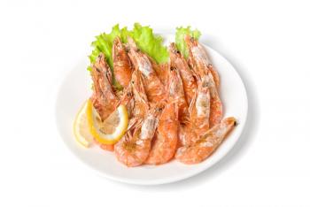 tasty shrimp with lemon and lettuce isolated on a white

