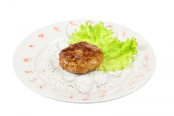 Royalty Free Photo of a Beef Cutlet on a Plate