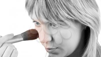 Royalty Free Photo of a Woman Applying Make-up With a Brush