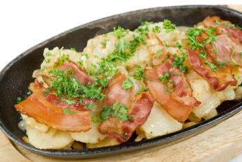 Royalty Free Photo of Fried Potatoes With Bacon and Vegetables