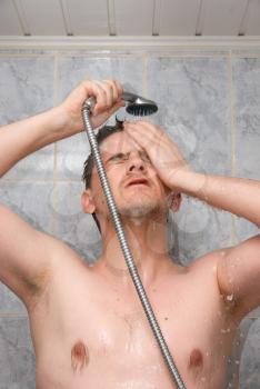 Royalty Free Photo of a Man Showering 