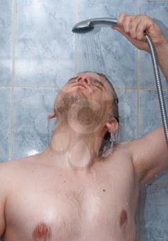 Royalty Free Photo of a Man Showering 