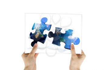 Royalty Free Photo of a Person Holding a Picture of a Puzzle