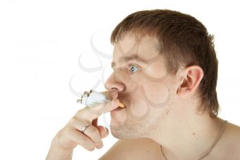 Royalty Free Photo of a Man Smoking Multiple Cigarettes