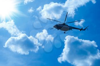 Royalty Free Photo of a Helicopter Flying in the Sky