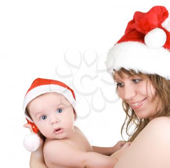 Royalty Free Photo of a Mother and Son Wearing Santa Hats