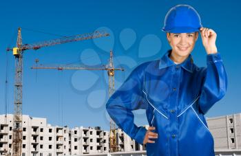 Royalty Free Photo of a Female Builder on a Building Background
