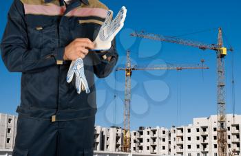 Royalty Free Photo of a Worker Putting on Gloves