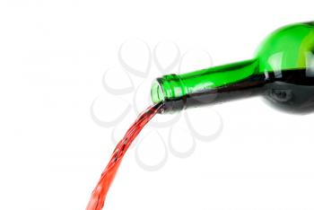 Pouring red wine isolated on white background