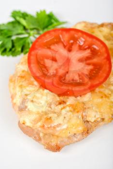 Royalty Free Photo of Roasted Pork Steak Baked With Cheese and Tomato