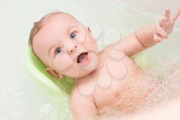 Royalty Free Photo of a Baby Boy Getting a Bath