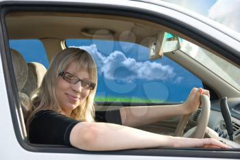Royalty Free Photo of a Woman Driving a Car